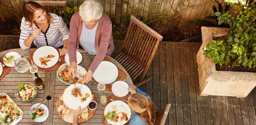 Three women sharing a meal outside