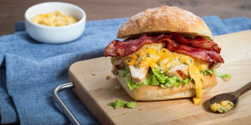 Dijon Chicken Melt Sandwich on a cutting board.