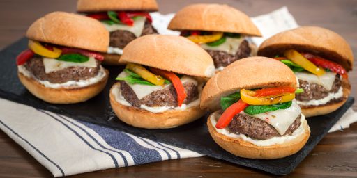 Six Mini Cheese Burgers served on a stone board