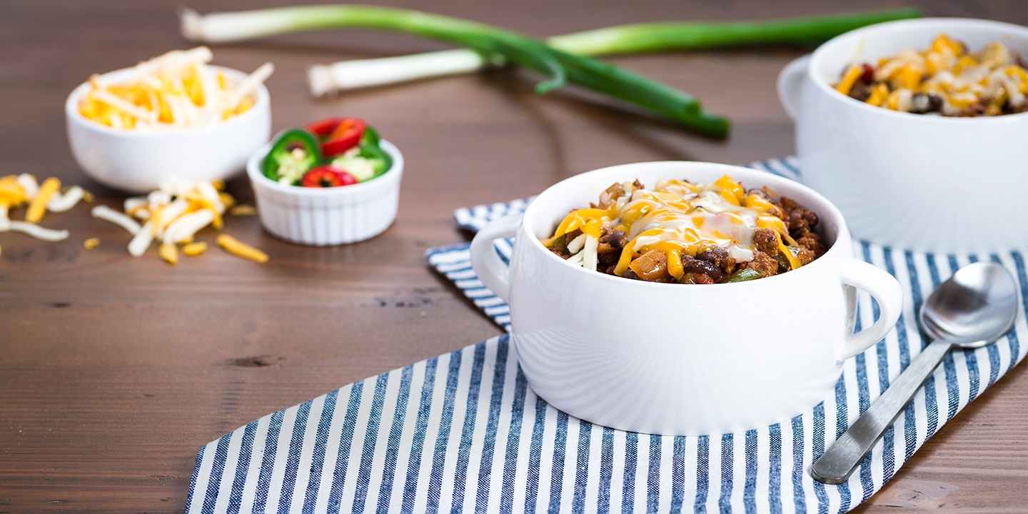 Texan Red Chili served with cheese in small bowls