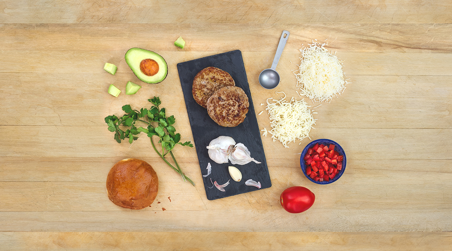 Ingredients for Bruschetta Turkey Burgers on a wooden countertop