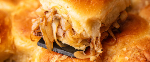 A close-up of roast beef sliders