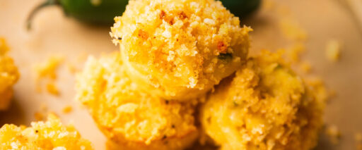 A close-up of baked mac and cheese bites